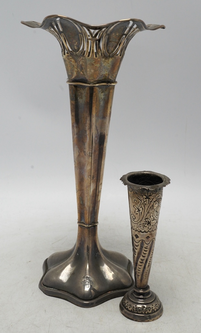 A George V pierced silver trumpet vase, Joseph Gloster Ltd, Birmingham, 1912, height 26.4cm, weighted, together with a smaller silver mounted posy vase. Condition - fair